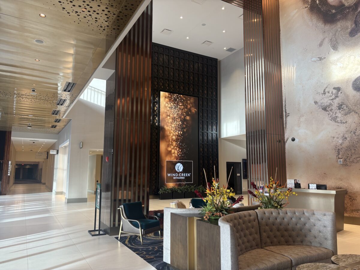 Interior of Wind Creek Hotel. Light and marble walls with couch seating and high ceilings