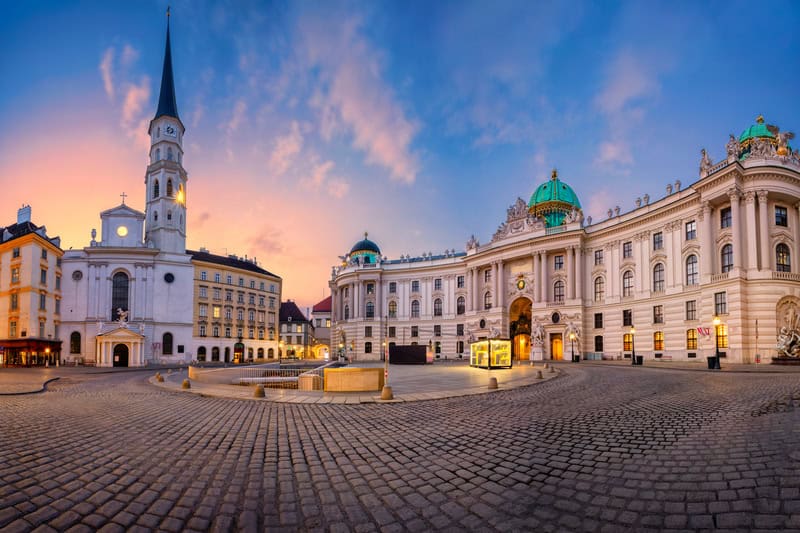 a plaza in Vienna Austria at sunset