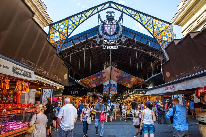 crowds buying food in la boqueria market in Barcelona, Spain