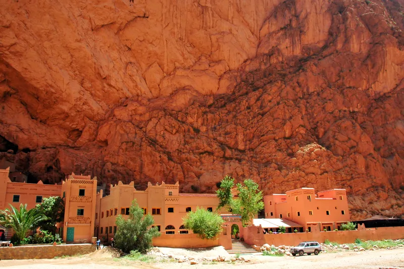 amazing desert hotel underneath a cliff in morocco