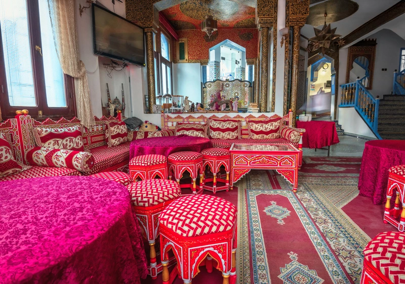 red and pink carpeting and rug in morocco hotel