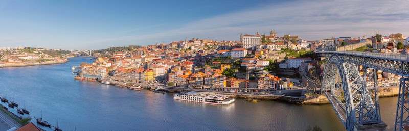skyline view of porto portugal and porto bridge