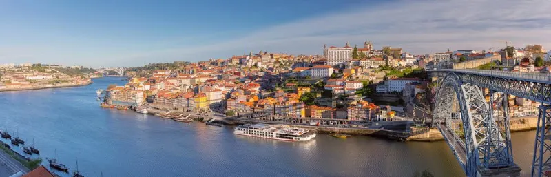 skyline view of porto portugal and porto bridge