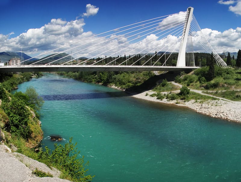 large white cable stay bridge in Montenegrin mountains