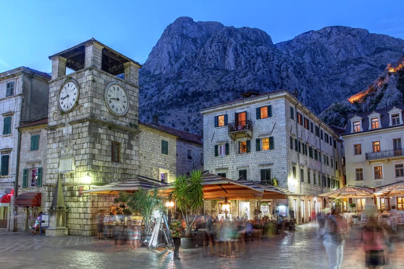 old town Perast in Montenegro with brick buildings and mountains