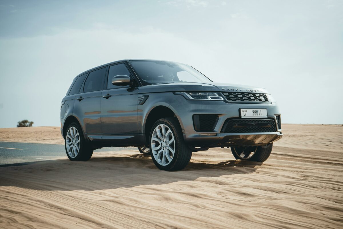 range rover driving in the desert in Dubai
