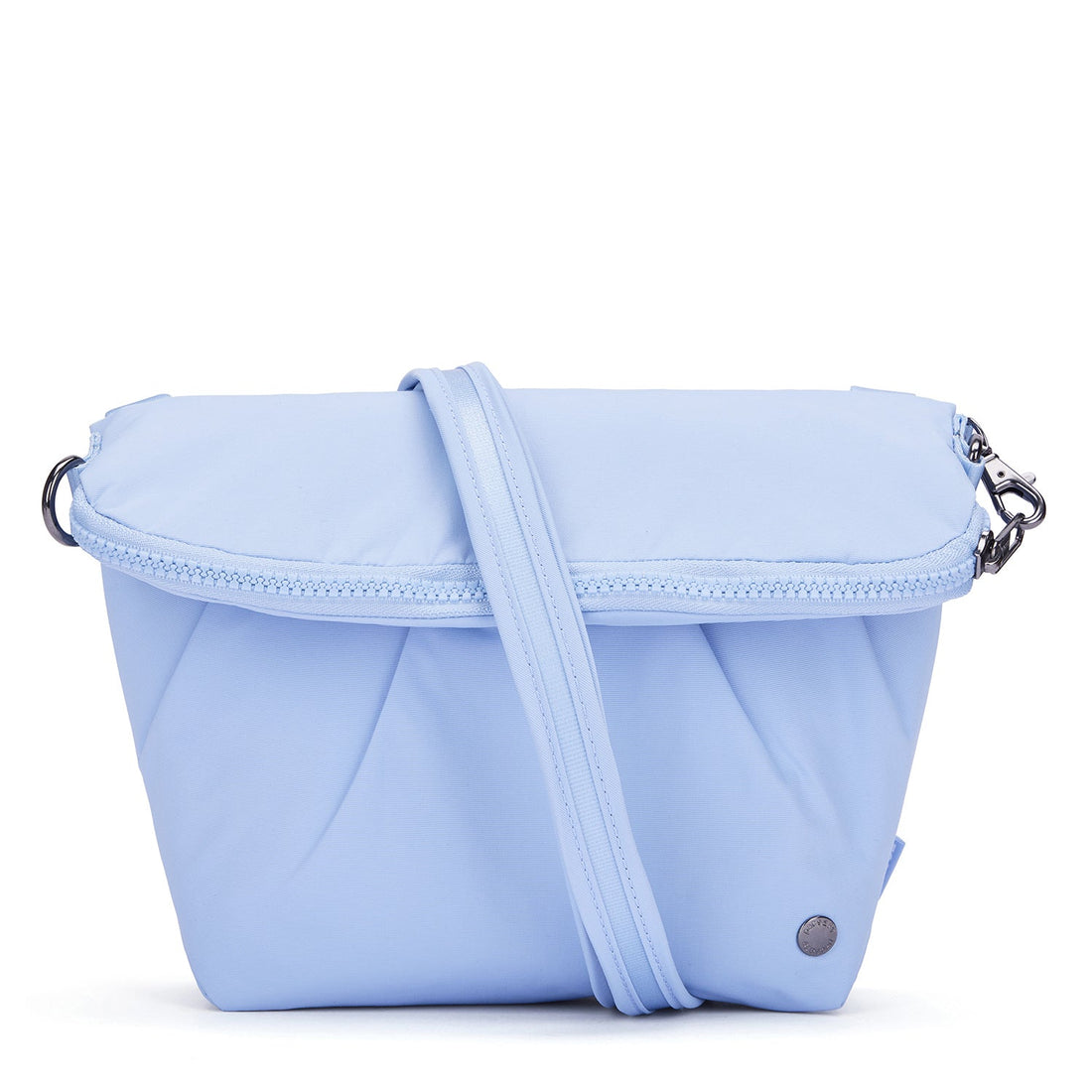 Pacsafe CX anti-theft convertible crossbody in serenity blue, expands from 3L to 5L.
