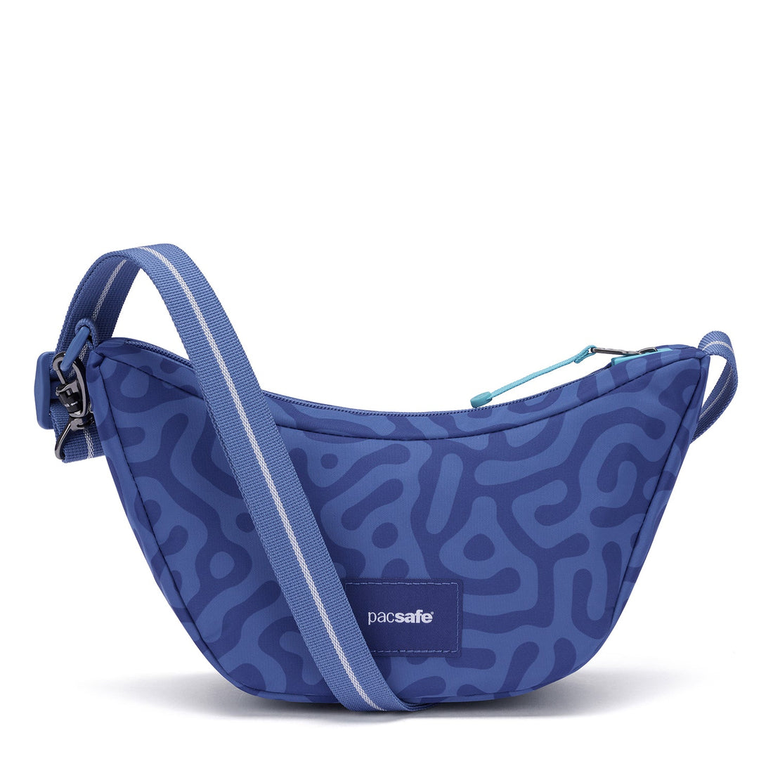 Pacsafe GO anti-theft Lunar crossbody in cerulean blue, worn as a crossbody or sling.