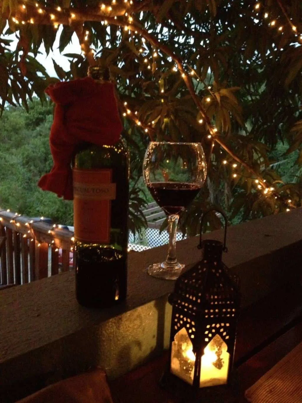 Bottle of wine on a candle lit table in a restaurant on Vieques Island.  